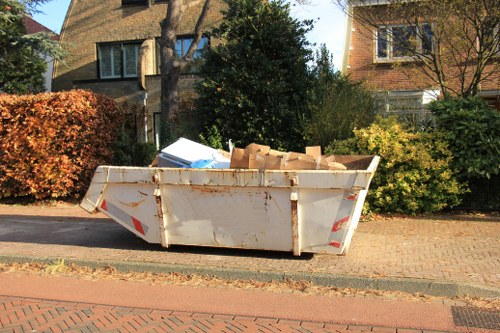 Before and after garden clearance in a Bow residence